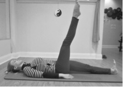 Photo: Woman demonstrates Single Leg Circle exercise