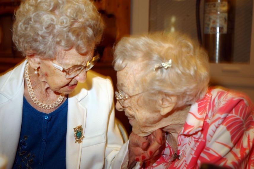 Two older women smiling